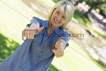 Woman showing thumbs up gesture