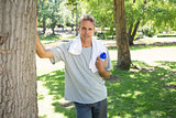 Man with bottle of water in park