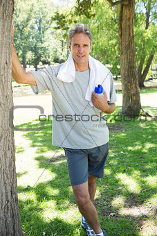 Man with water bottle and towel