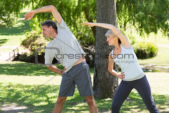 Couple doing stretching exercise