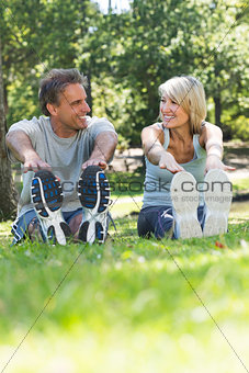 Couple stretching in the park