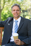 Businessman with disposable coffee cup