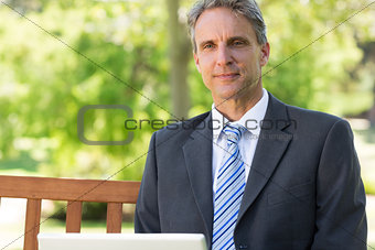 Thoughtful businessman at park
