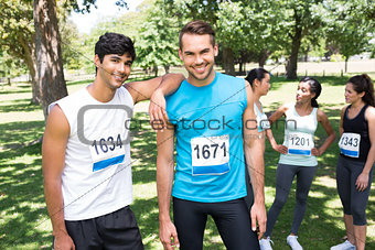 Happy marathon runners in park