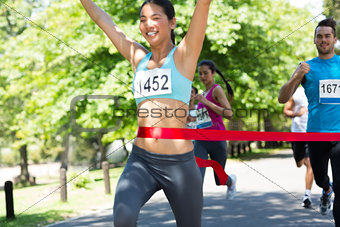 Marathon runner crossing finish line