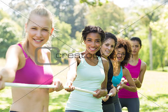 Women pulling a rope in tug of war