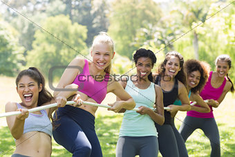 Women pulling a rope in tug of war