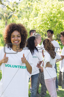 Female volunteer gesturing thumbs up