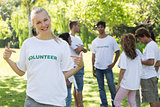 Beautiful volunteer pointing at tshirt
