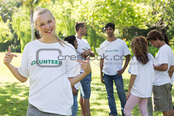Beautiful volunteer pointing at tshirt