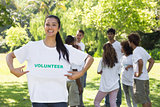 Happy female volunteer holding tshirt