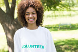 Confident female volunteer in park