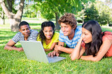 Group of students using laptop