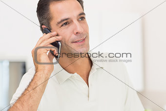 Closeup of a man using mobile phone at home