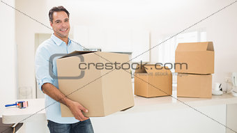Man carrying boxes in a new house