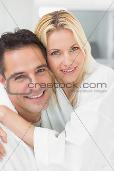 Closeup portrait of a woman embracing man