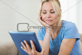 Closeup of a beautiful young woman with digital tablet
