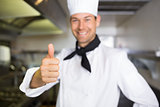 Portrait of a smiling male cook gesturing thumbs up