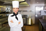Portrait of smiling female cook in kitchen