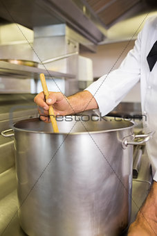 Male chef preparing food in kitchen