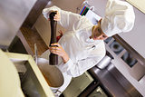 Female cook preparing food in kitchen