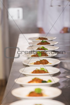 Cooked food in a row on kitchen counter