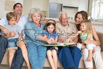 Family reading storybook at home