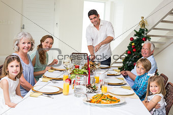 Family having Christmas meal at dining table