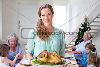 Smiling mother with Christmas meal