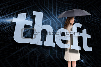 Businesswoman holding umbrella behind the word theft