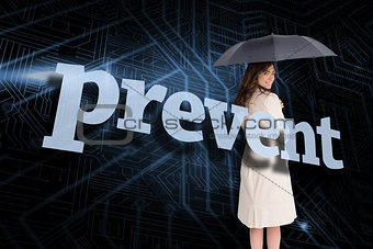 Businesswoman holding umbrella behind the word prevent
