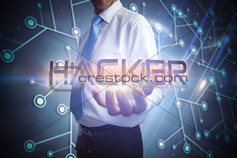 Businessman presenting the word hacker