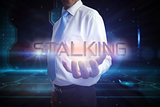 Businessman presenting the word stalking