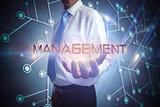 Businessman presenting the word management