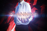 Businessman presenting the word planning