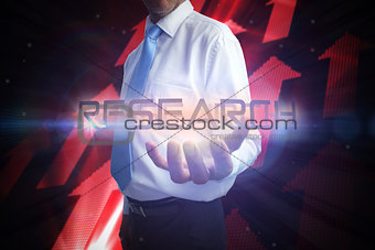 Businessman presenting the word research