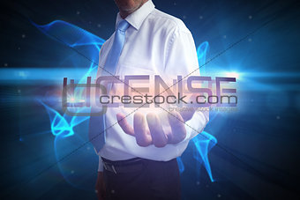 Businessman presenting the word license