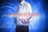 Businessman presenting the word marketing