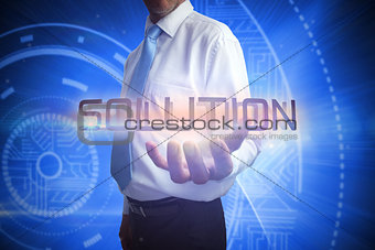 Businessman presenting the word solution