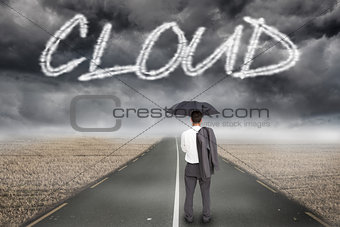 Cloud against misty brown landscape with street
