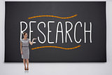 Businesswoman presenting the word research