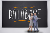 Business people standing against the word database