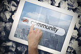 Hand touching community on search bar on tablet screen