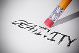 Pencil erasing the word Creativity