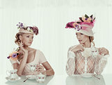 blonde girls with classical tea set and flower hat
