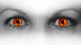 Detail view of female eyes with flames