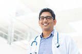 Smiling Asian Indian male medical doctor