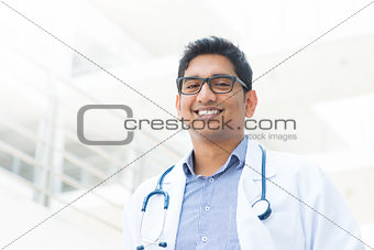 Smiling Asian Indian male medical doctor