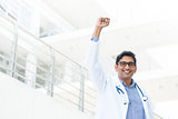 Asian Indian male medical doctor celebrating success