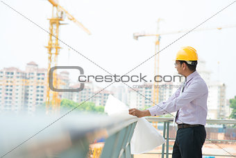 Asian Indian architect at construction site
